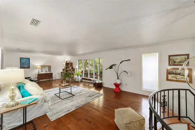 a large bedroom with a large bed and furniture