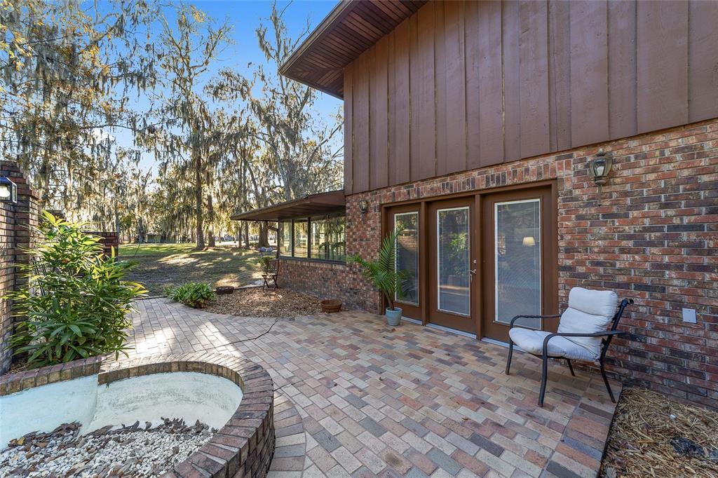 6015 Southwest 36th Way Gainesville, FL 32608 - Photo 55 of 67 a backyard of a house with outdoor seating