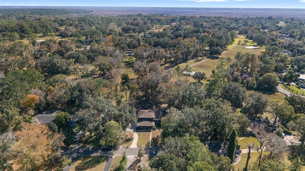 6015 Southwest 36th Way Gainesville, FL 32608 - Photo 60 of 67 an aerial view of house with yard and mountain view in back