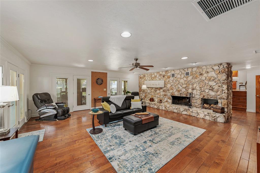 6015 Southwest 36th Way Gainesville, FL 32608 - Photo 7 of 67 a living room with furniture and a fireplace