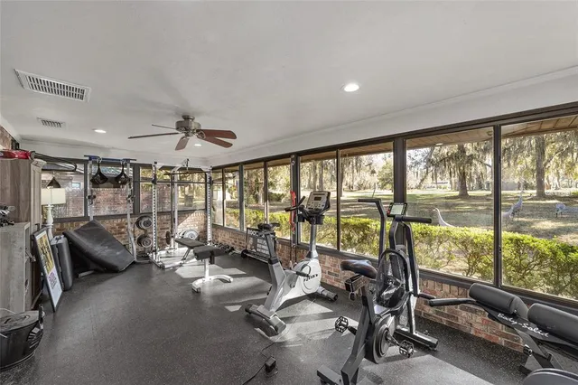 a view of a hallway with furniture and entryway