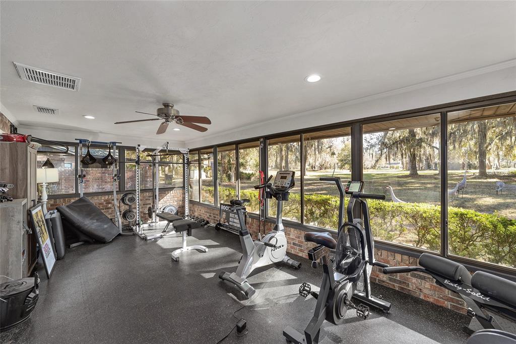 6015 Southwest 36th Way Gainesville, FL 32608 - Photo 10 of 67 a living room with furniture and large windows