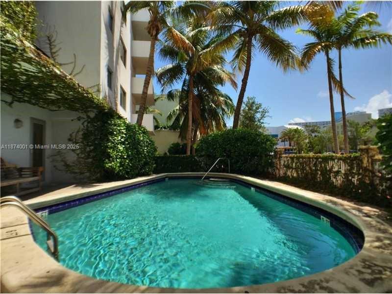 1025 Alton Road, Unit 507 Miami Beach, FL 33139 - Photo 2 of 28 a view of swimming pool from a yard
