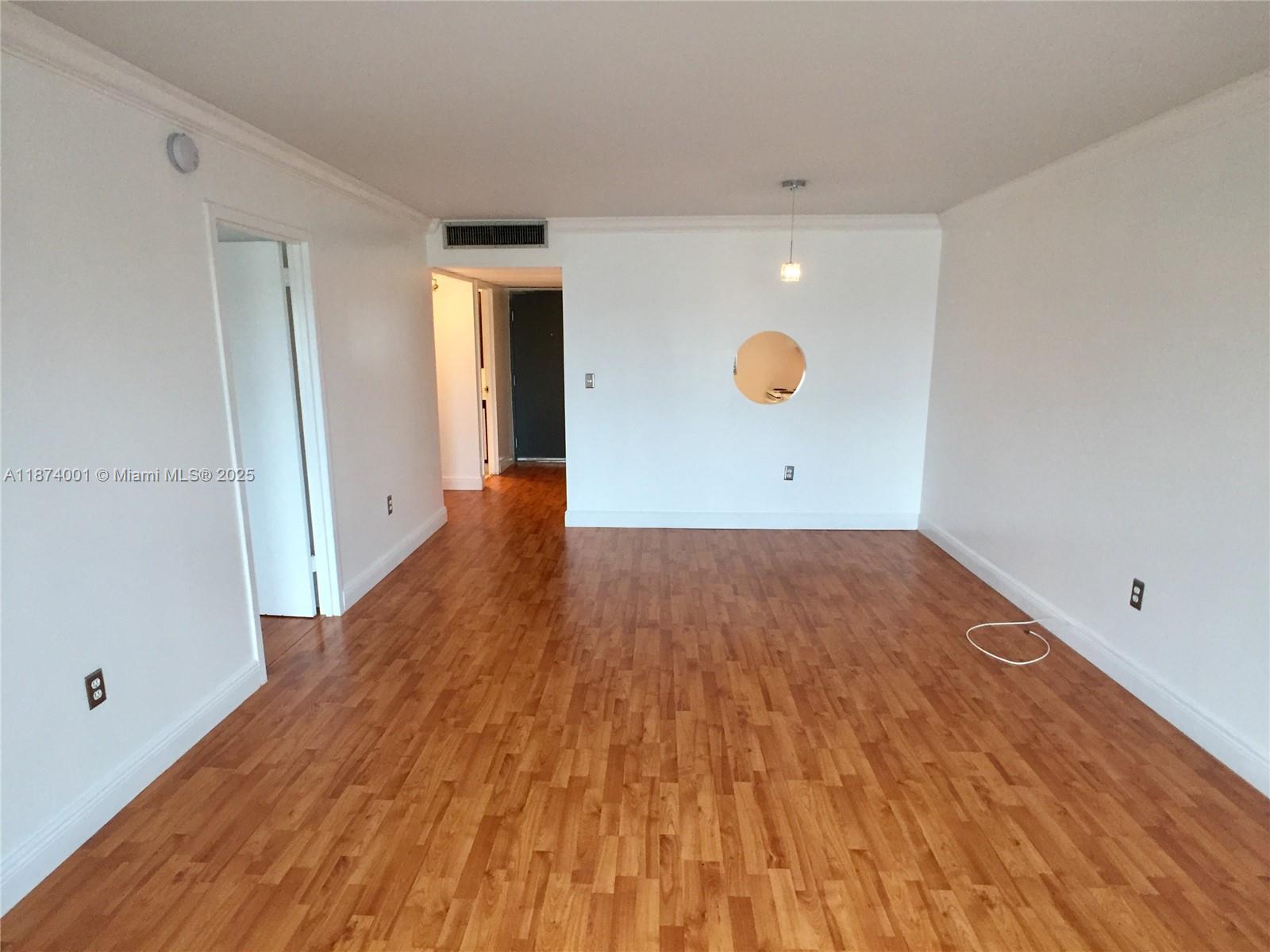1025 Alton Road, Unit 507 Miami Beach, FL 33139 - Photo 21 of 28 a view of a room with wooden floor