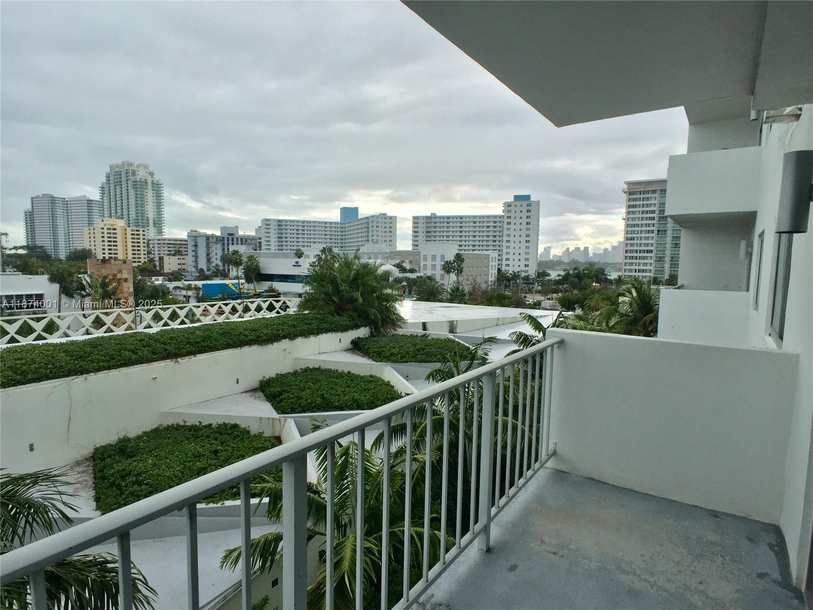 1025 Alton Road, Unit 507 Miami Beach, FL 33139 - Photo 4 of 28 a view of a city from a balcony