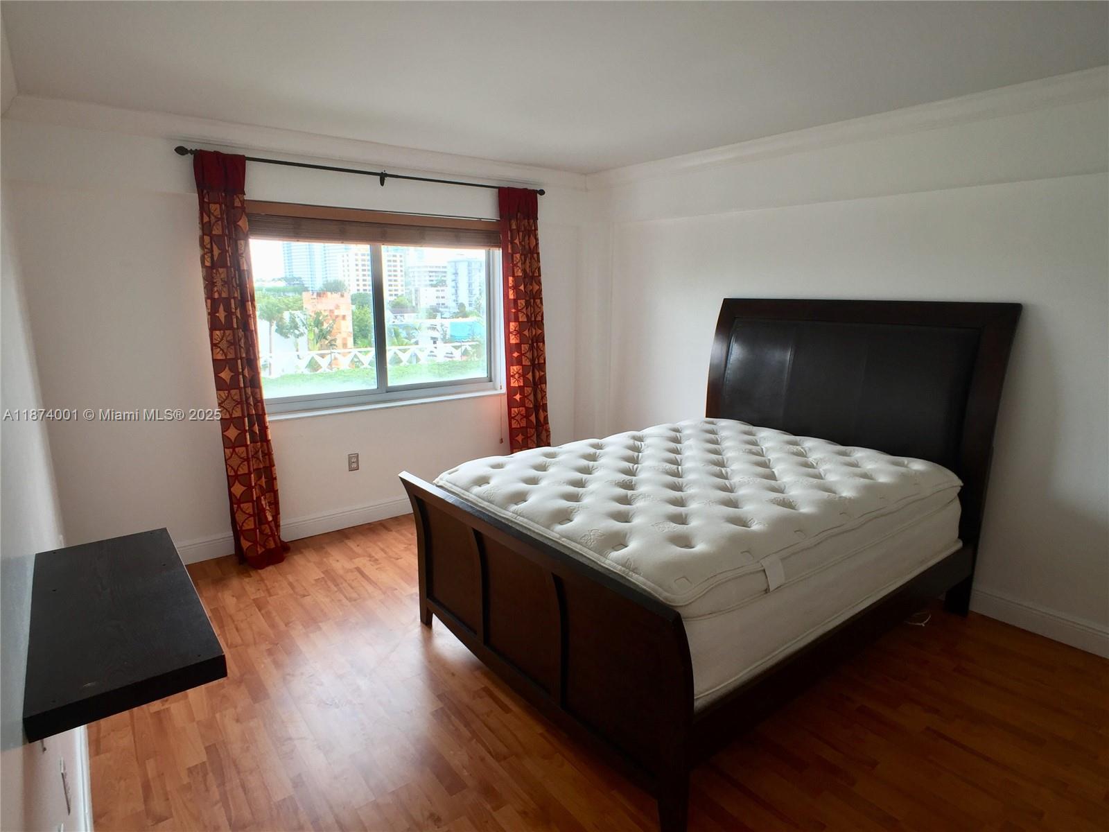 1025 Alton Road, Unit 507 Miami Beach, FL 33139 - Photo 6 of 28 a bedroom with a bed and window