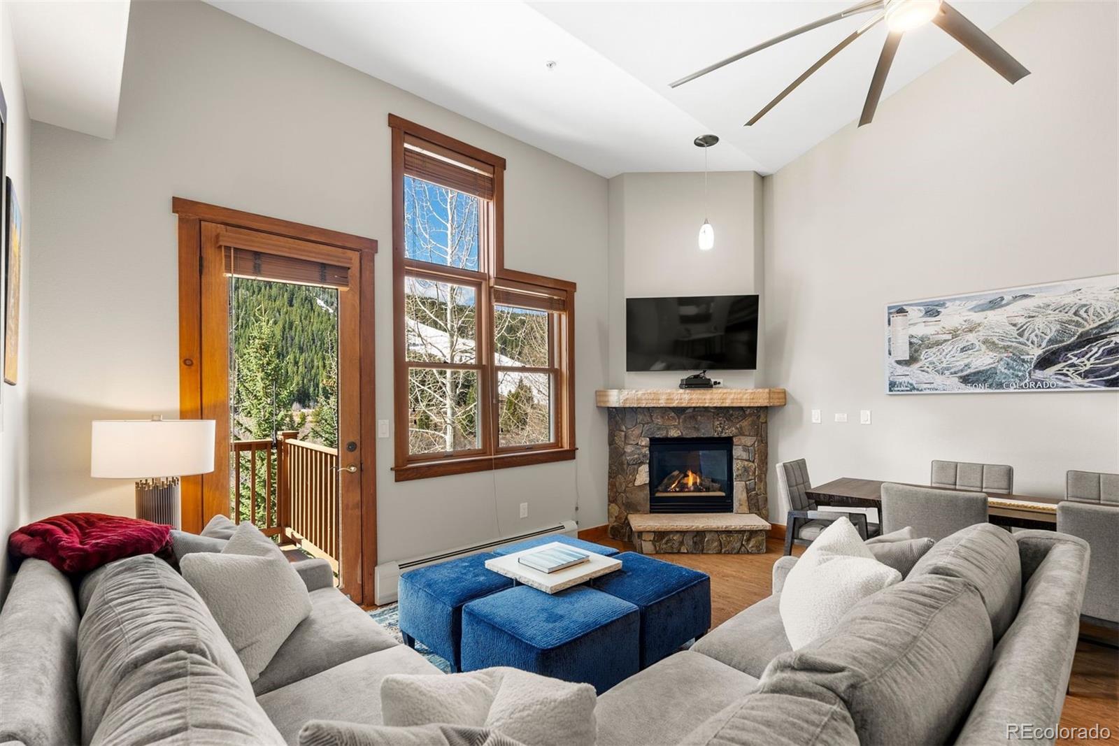a living room with furniture fireplace and flat screen tv