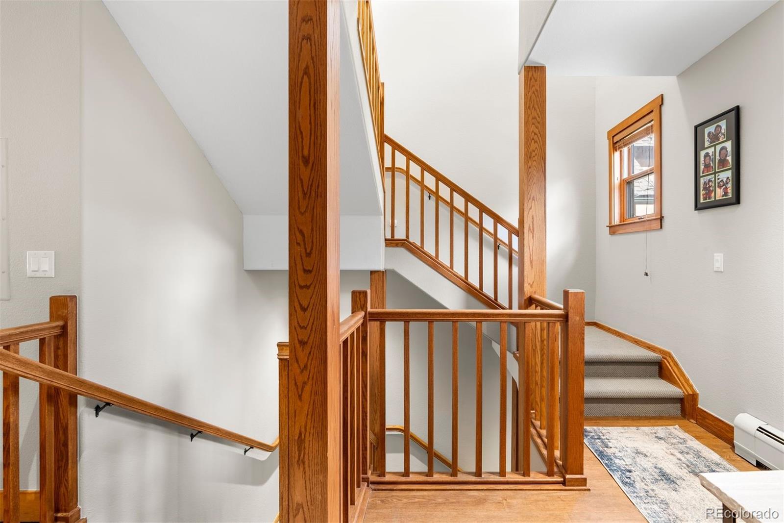 88 Hawk Circle, Unit 2349 Dillon, CO 80435 - Photo 12 of 26 a view of staircase with lots of frames on wall and a window