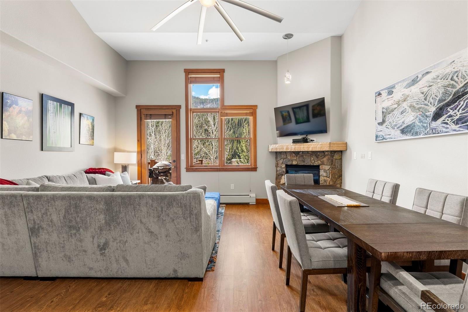 88 Hawk Circle, Unit 2349 Dillon, CO 80435 - Photo 2 of 26 a living room with furniture a flat screen tv and a fireplace