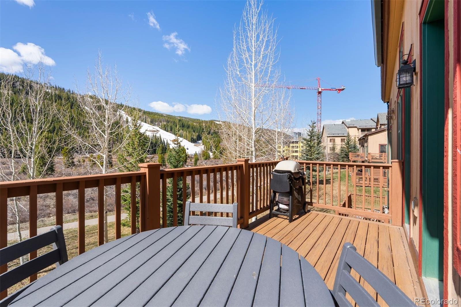 88 Hawk Circle, Unit 2349 Dillon, CO 80435 - Photo 23 of 26 a view of balcony with wooden floor and outdoor seating