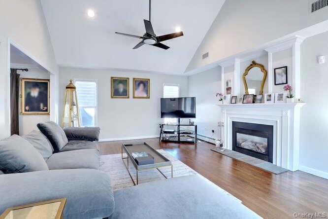 89 Spook Rock Road Suffern, NY 10901 - Photo 6 of 44 a living room with furniture a window and a fireplace