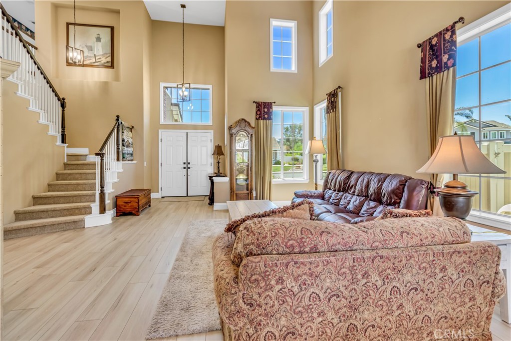28308 Corte Ocaso Temecula, CA 92592 - Photo 11 of 43 a living room with furniture and a view of hallway