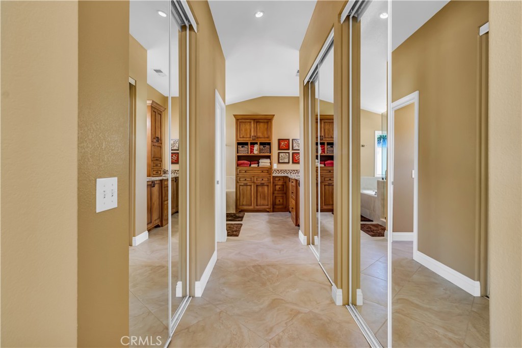 28308 Corte Ocaso Temecula, CA 92592 - Photo 25 of 43 a view of a hallway with a livingroom and furniture