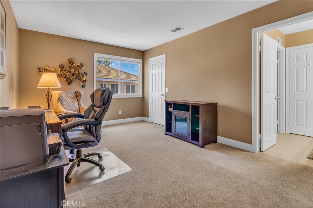 28308 Corte Ocaso Temecula, CA 92592 - Photo 28 of 43 a view of a workspace with furniture and a window
