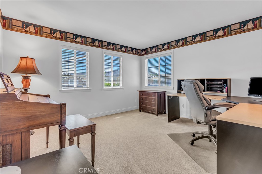 28308 Corte Ocaso Temecula, CA 92592 - Photo 29 of 43 a view of a workspace with furniture and a window