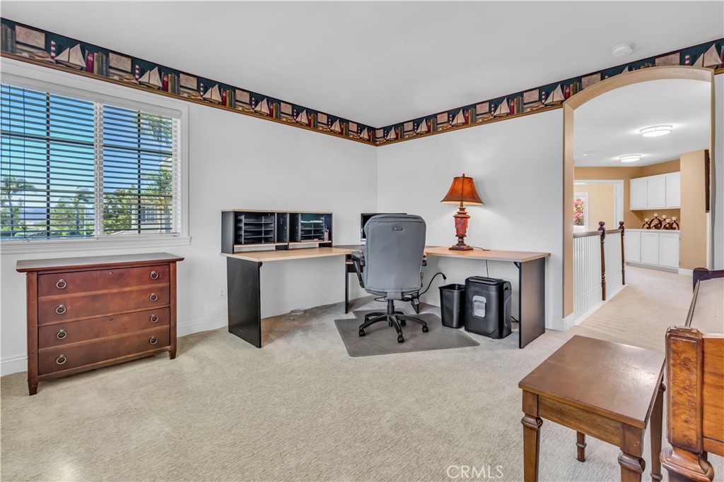 28308 Corte Ocaso Temecula, CA 92592 - Photo 31 of 43 a workspace with furniture window and a fireplace