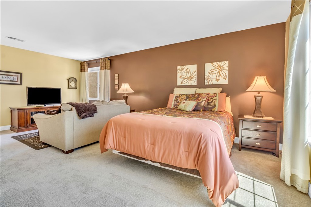 28308 Corte Ocaso Temecula, CA 92592 - Photo 32 of 43 a bedroom with bed tv and window