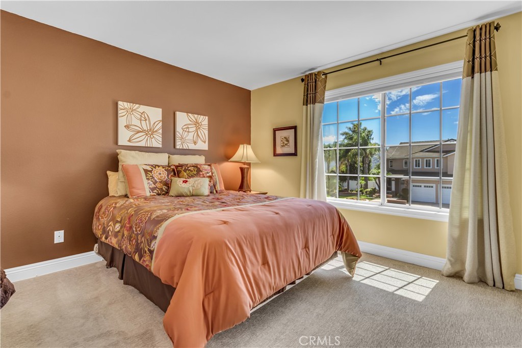 28308 Corte Ocaso Temecula, CA 92592 - Photo 34 of 43 a bedroom with a bed and a window