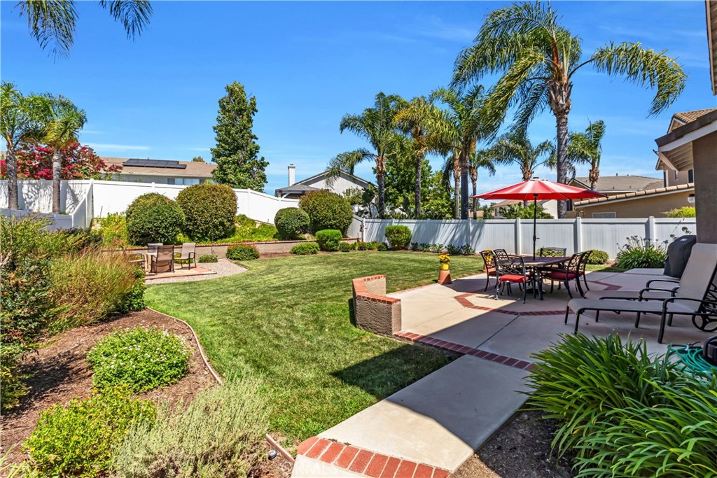 28308 Corte Ocaso Temecula, CA 92592 - Photo 36 of 43 an outdoor space with patio furniture and a garden