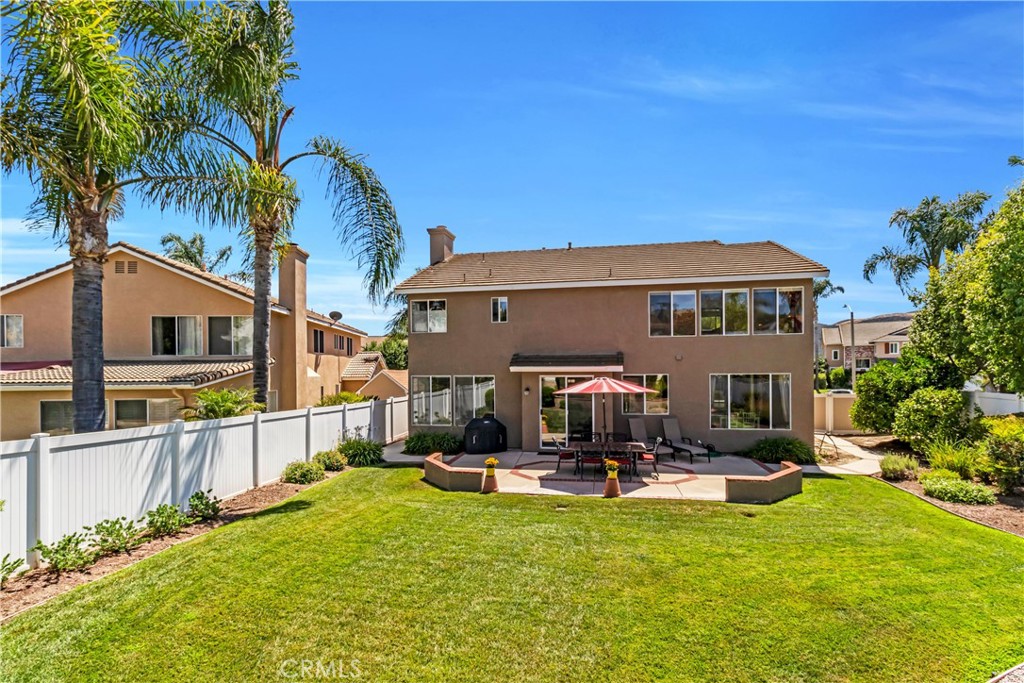 28308 Corte Ocaso Temecula, CA 92592 - Photo 39 of 43 a swimming pool with outdoor seating and yard