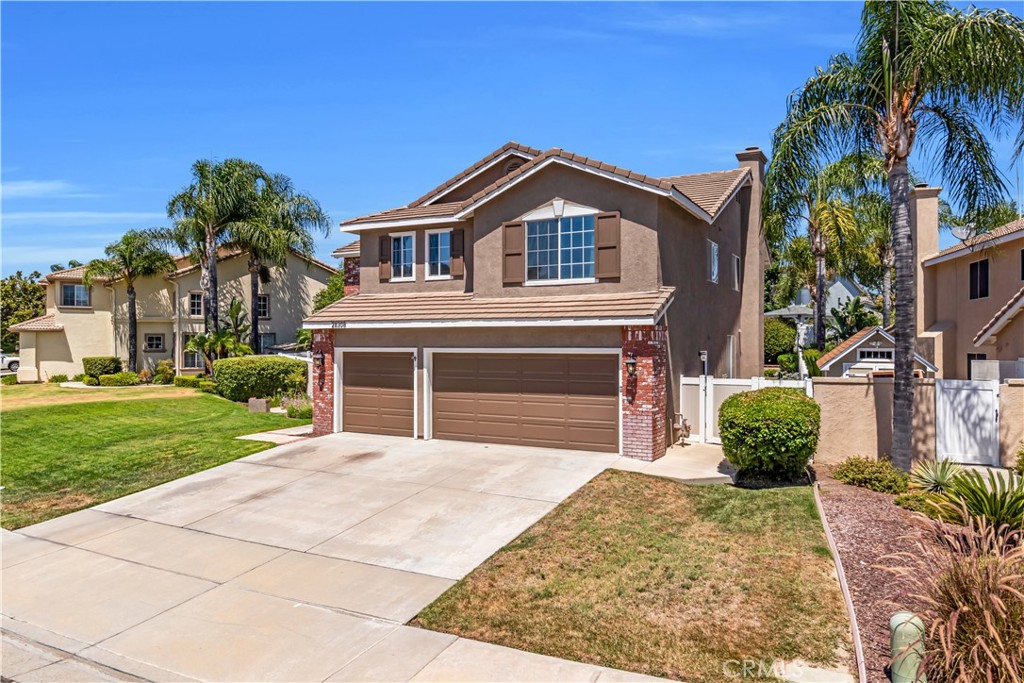 28308 Corte Ocaso Temecula, CA 92592 - Photo 4 of 43 a front view of a house with a yard and garage