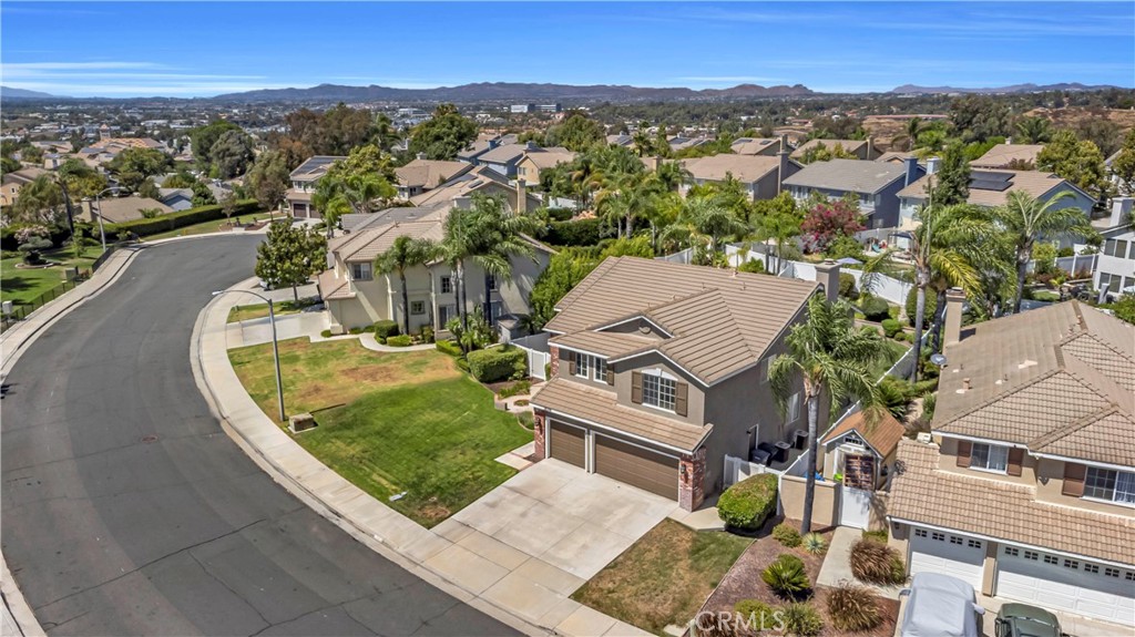 28308 Corte Ocaso Temecula, CA 92592 - Photo 42 of 43 an aerial view of residential houses with outdoor space and parking