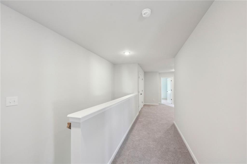 11124 Suria Drive Covington, GA 30014 - Photo 22 of 31 a view of hallway