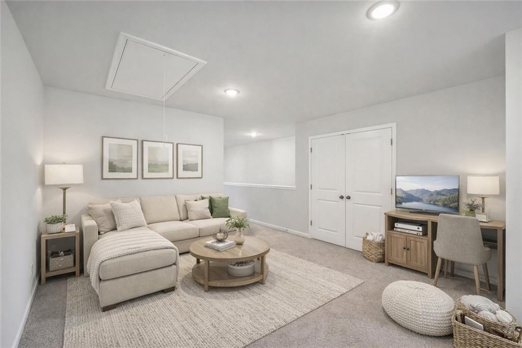 11124 Suria Drive Covington, GA 30014 - Photo 23 of 31 a living room with furniture and a wooden floor