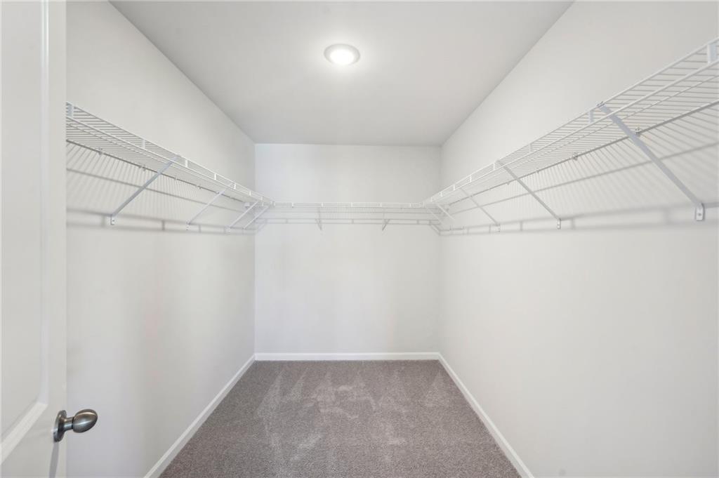 11124 Suria Drive Covington, GA 30014 - Photo 24 of 31 a view of a room with racks on the wall