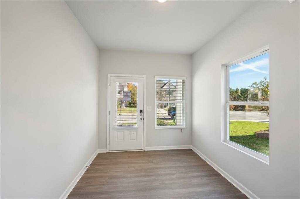 11124 Suria Drive Covington, GA 30014 - Photo 3 of 31 an empty room with windows and closet