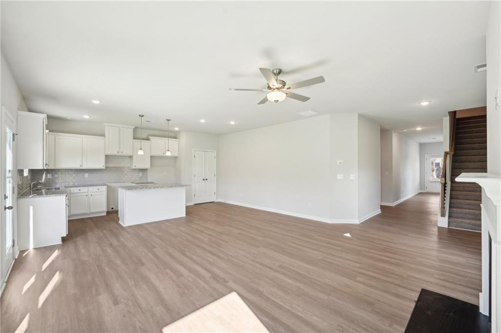 11124 Suria Drive Covington, GA 30014 - Photo 7 of 31 a view of kitchen with kitchen island sink stainless steel appliances and cabinets