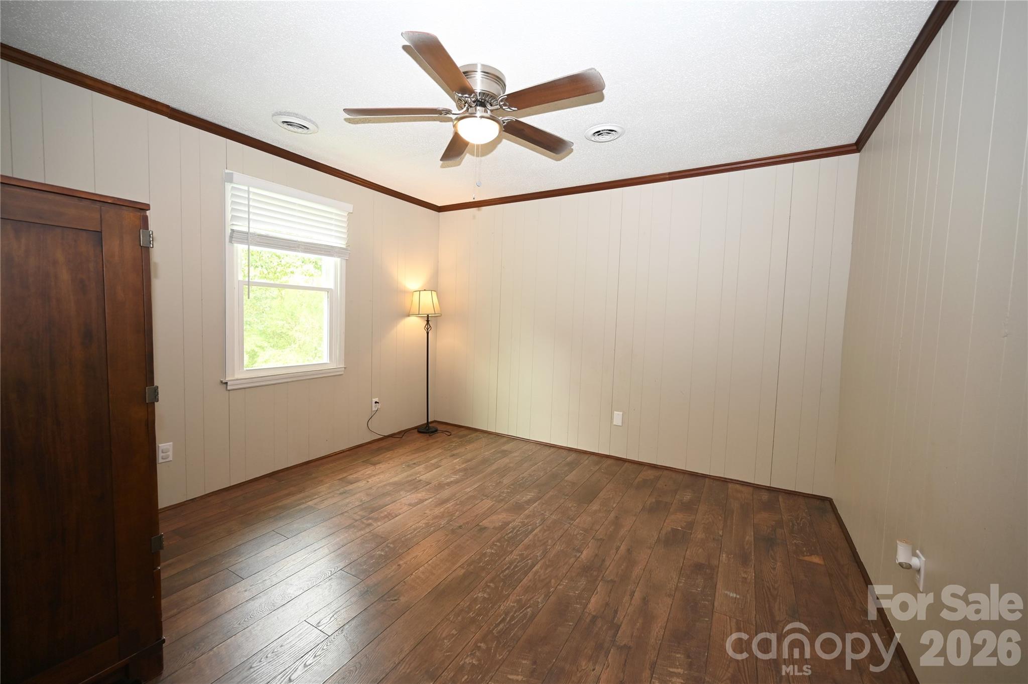 114 Gaston Street Chester, SC 29706 - Photo 12 of 15 an empty room with wooden floor and windows