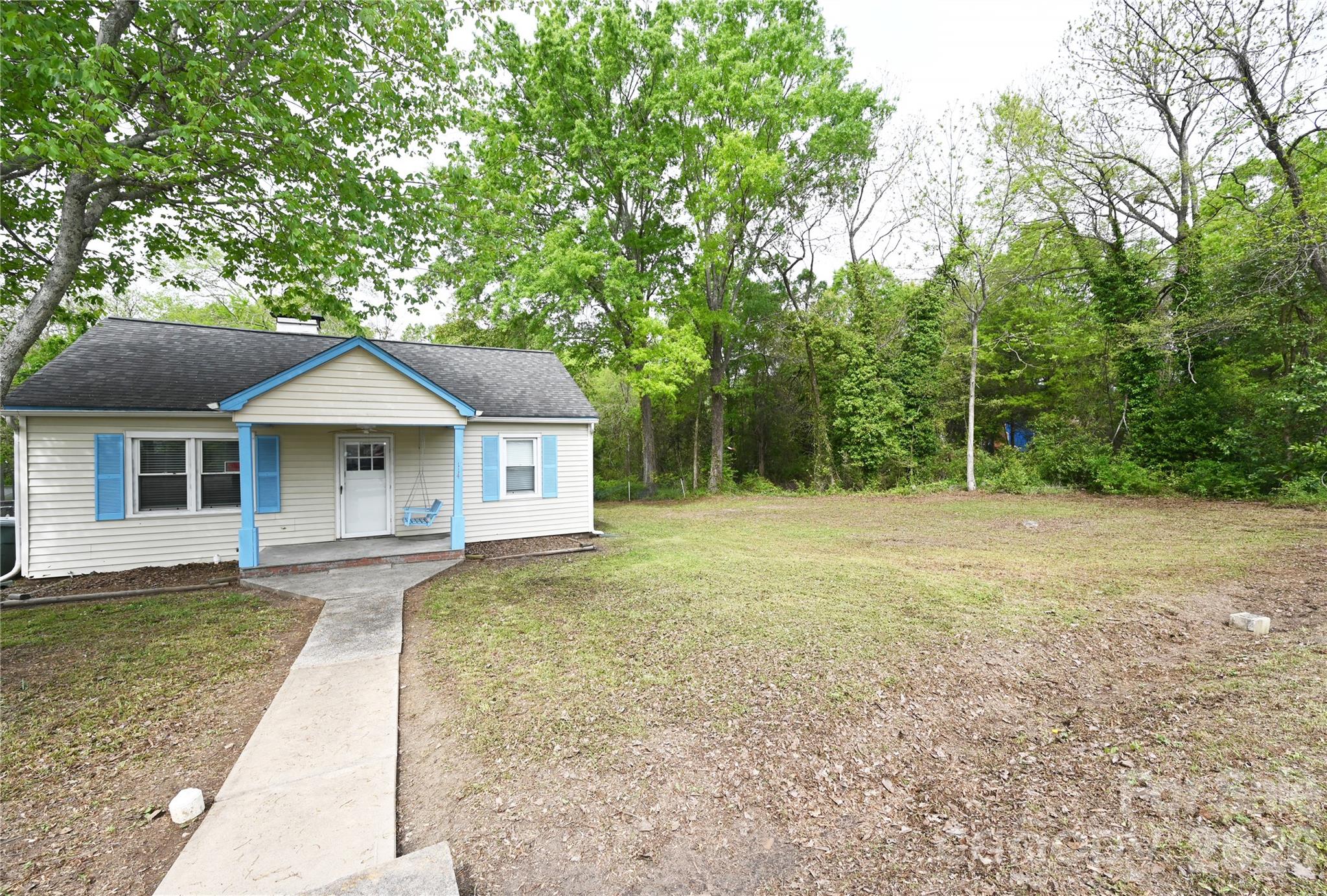 114 Gaston Street Chester, SC 29706 - Photo 3 of 15 a house with trees in the background