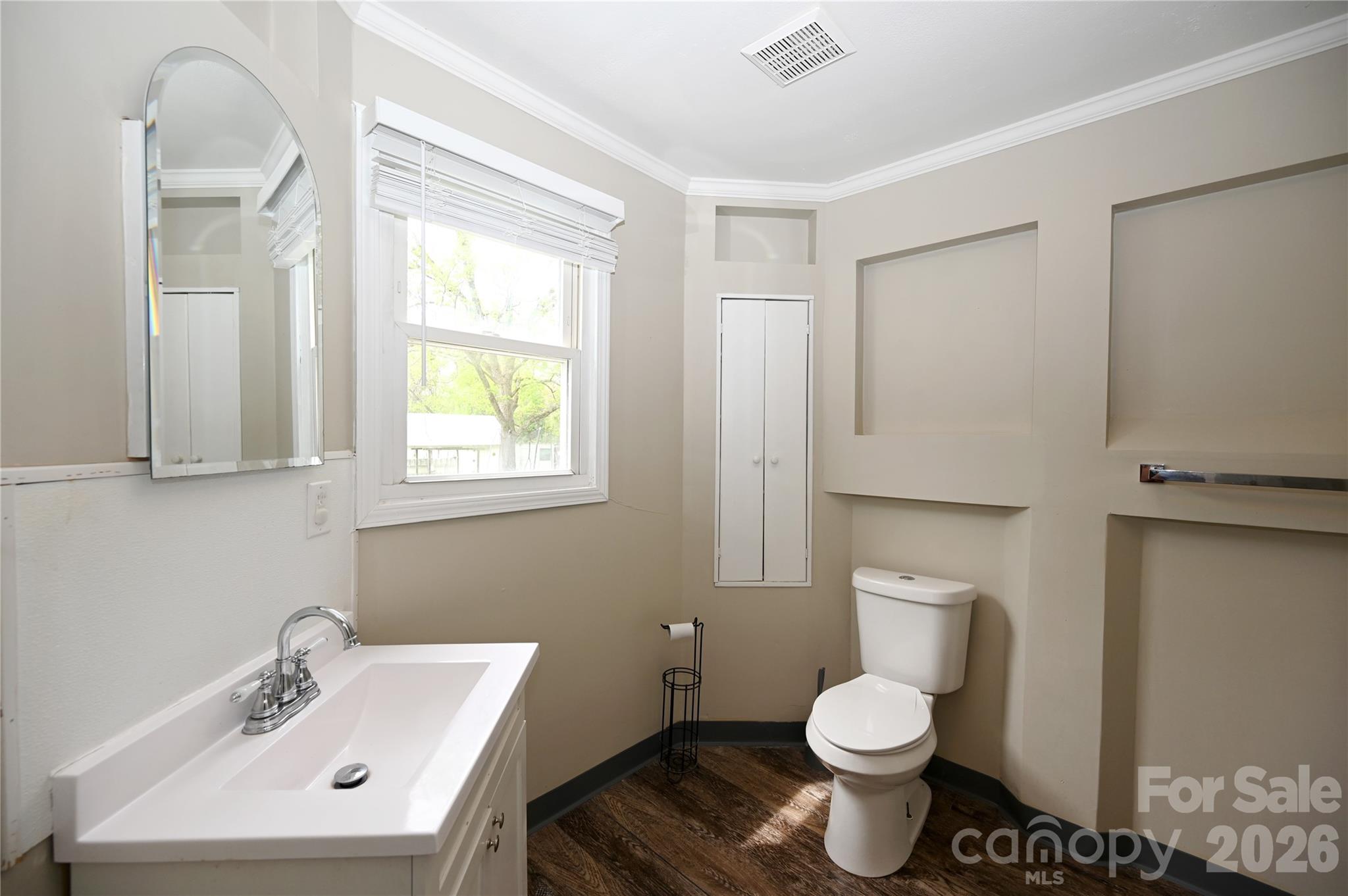 114 Gaston Street Chester, SC 29706 - Photo 8 of 15 a bathroom with a toilet sink and mirror