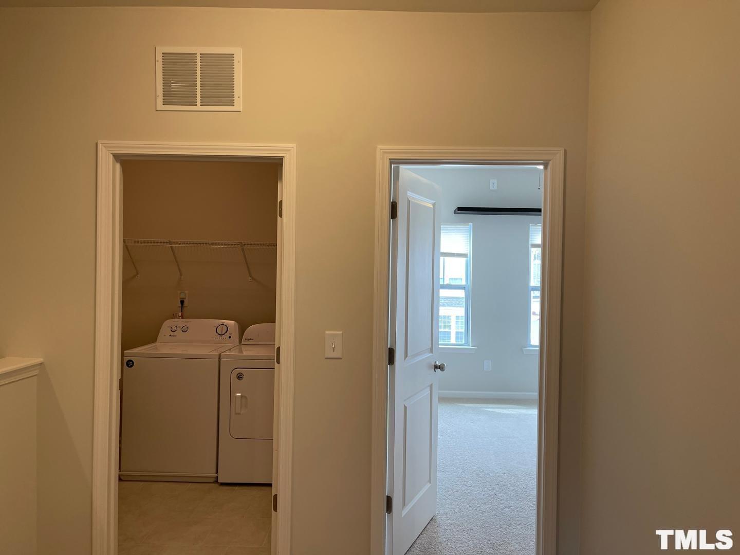 343 Great Northern Station Apex, NC 27502 - Photo 17 of 29 a view of a hallway with closet and bathroom