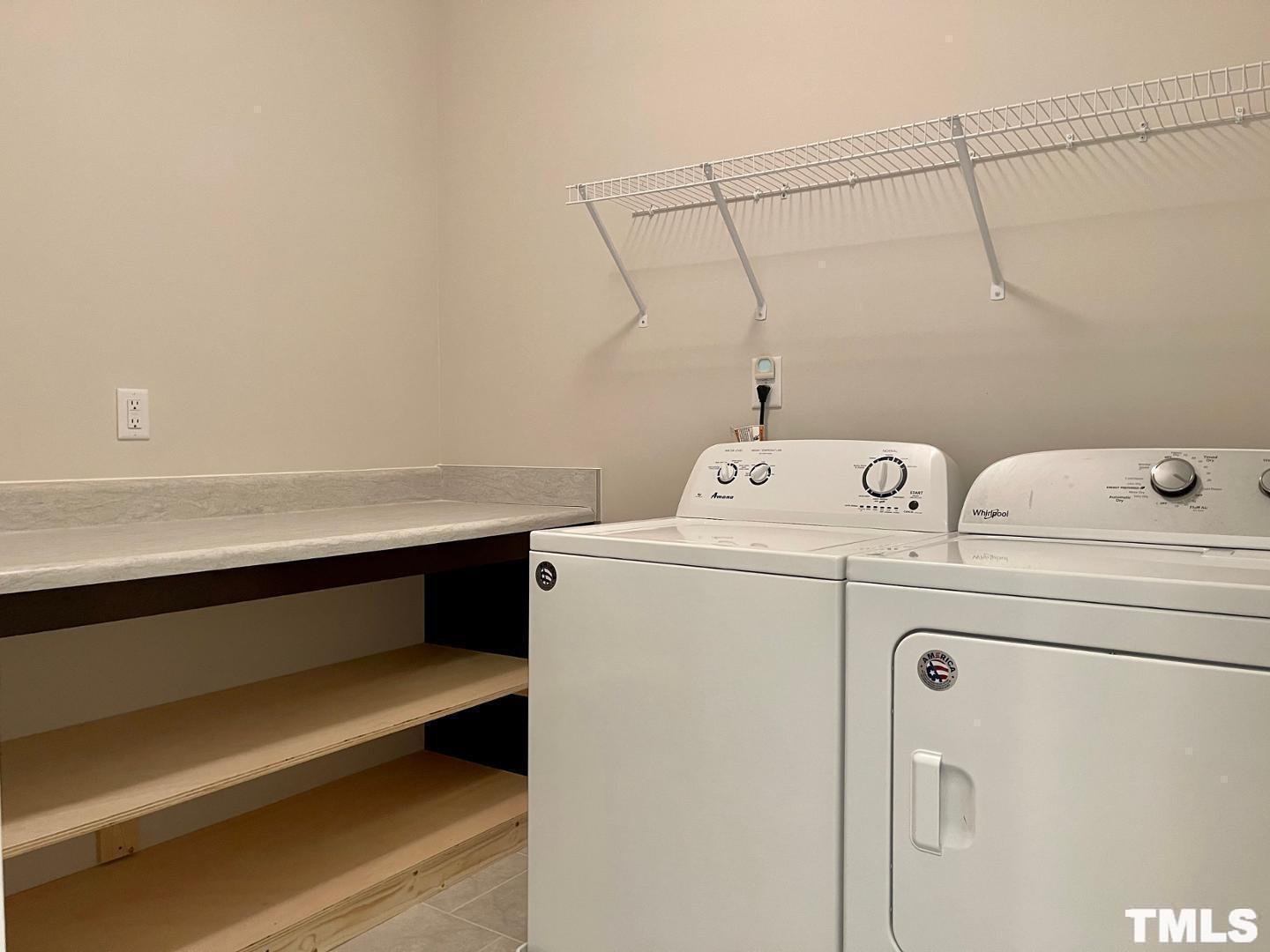 343 Great Northern Station Apex, NC 27502 - Photo 18 of 29 a utility room with dryer and washer