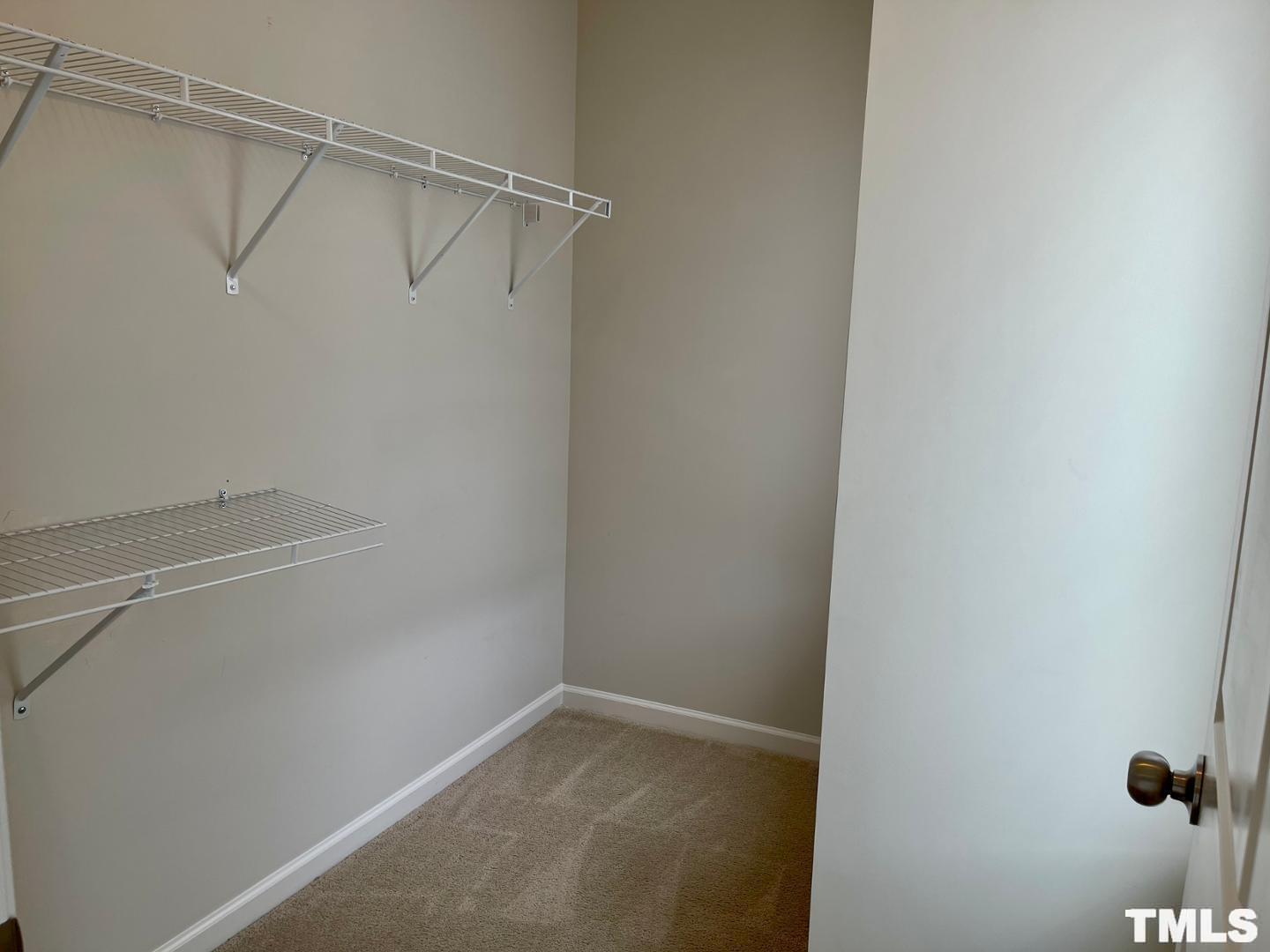 343 Great Northern Station Apex, NC 27502 - Photo 23 of 29 a view of a room with racks on the wall