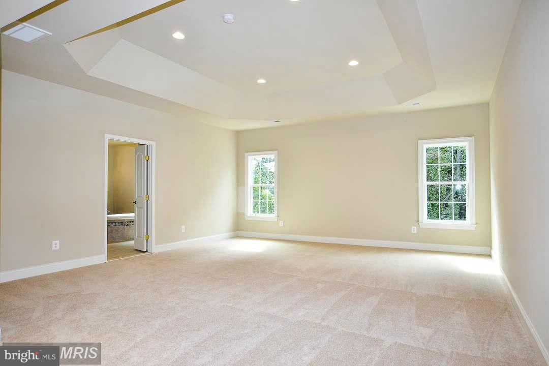 8536 Old Keene Mill Road Springfield, VA 22152 - Photo 18 of 30 a view of an empty room with a window