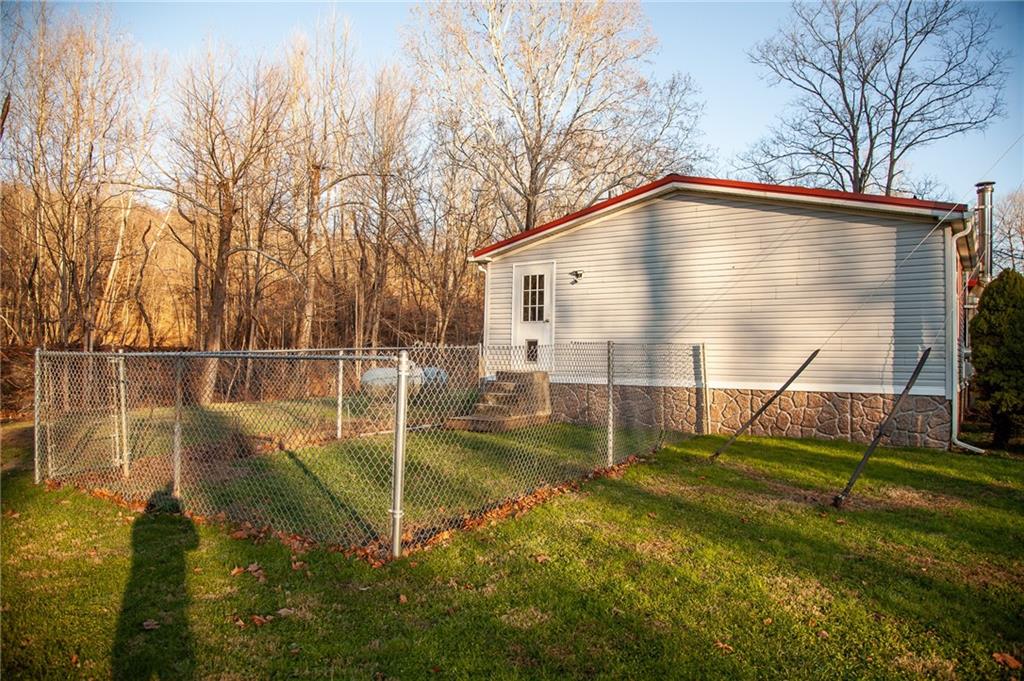 113 Williams Road Fayette City, PA 15438 - Photo 21 of 25 a backyard of a house with barbeque oven