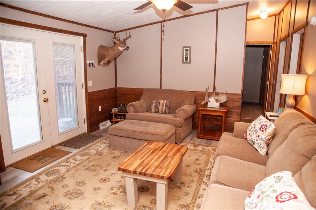113 Williams Road Fayette City, PA 15438 - Photo 8 of 25 a living room with furniture and a rug