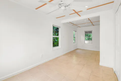 an empty room with windows and entrance