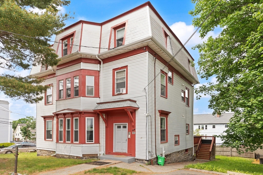 39 Union Street Boston, MA 02135 - Photo 1 of 33 a front view of a residential apartment building with a yard