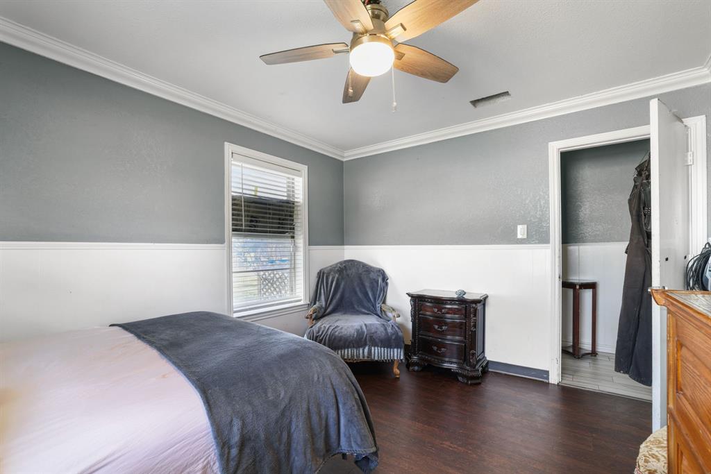 12475 Fm 2728 Terrell, TX 75161 - Photo 11 of 27 a bedroom with a bed and a chandelier