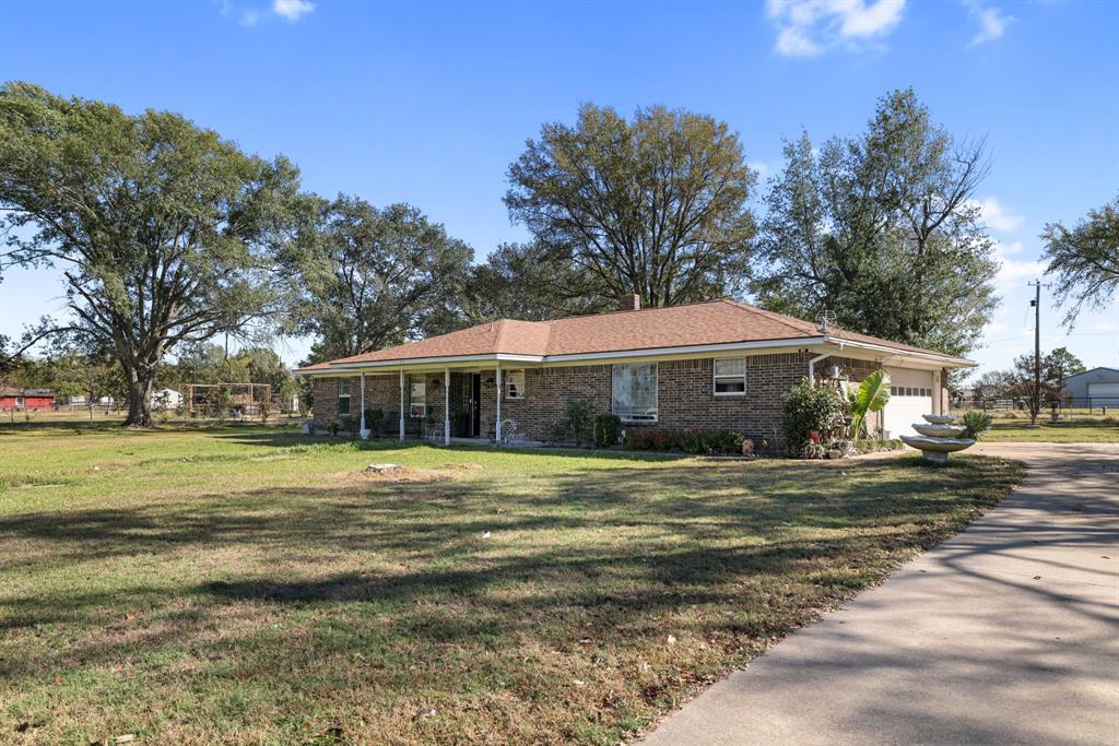 12475 Fm 2728 Terrell, TX 75161 - Photo 2 of 27 a front view of a house with a garden