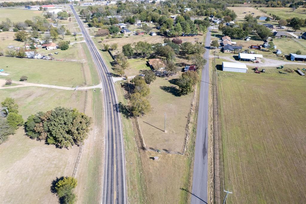 12475 Fm 2728 Terrell, TX 75161 - Photo 22 of 27 an aerial view of a house with a yard and lake view in back