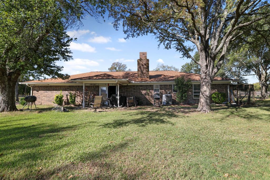 12475 Fm 2728 Terrell, TX 75161 - Photo 4 of 27 a view of a yard with large trees and a table