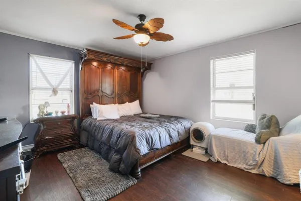 a bedroom with a bed and window