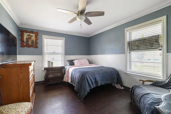 a bed room with a bed and a television