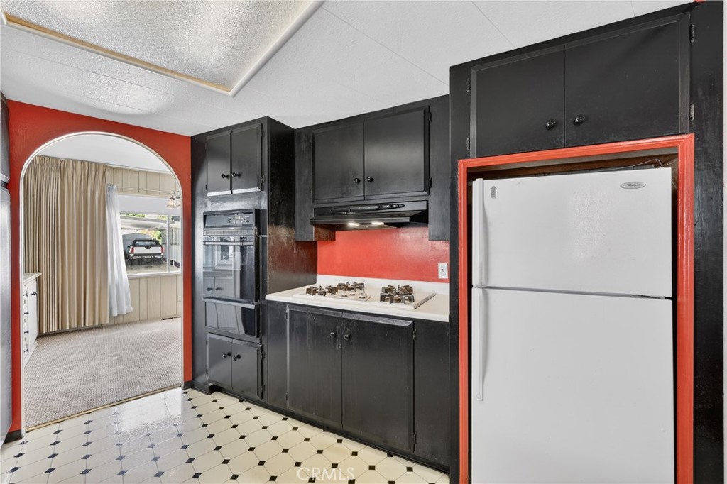 1001 East Lambert Road, Unit 258 La Habra, CA 90631 - Photo 14 of 75 a kitchen with stainless steel appliances a refrigerator and a sink