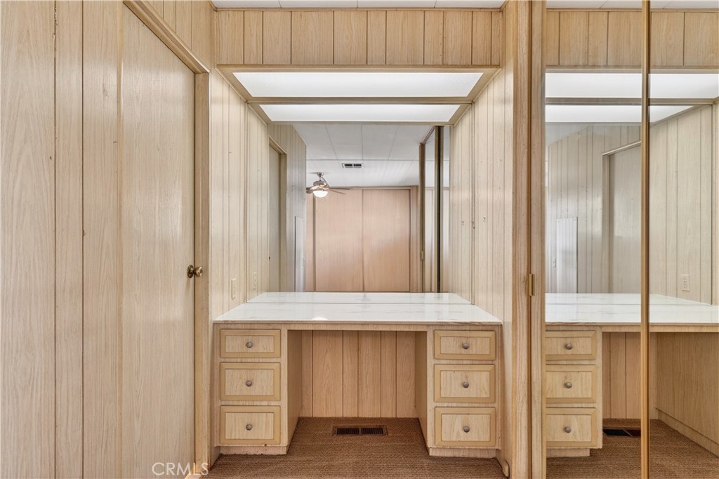 1001 East Lambert Road, Unit 258 La Habra, CA 90631 - Photo 24 of 75 a bathroom with a granite countertop sink and a mirror
